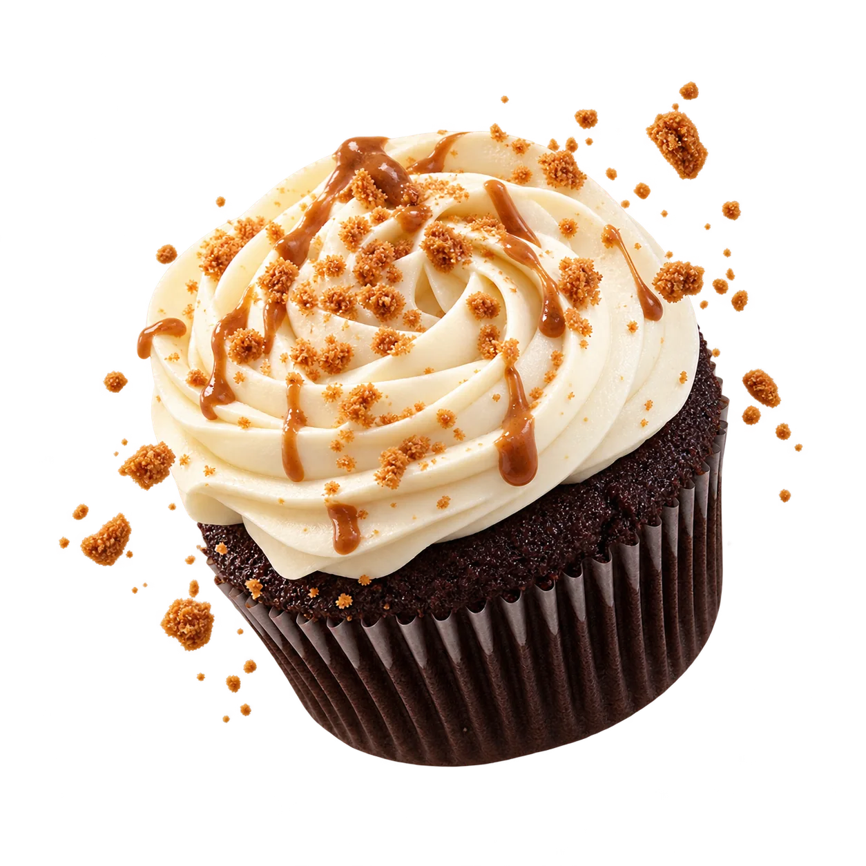 Biscoff cupcake with cookie crumbs floating against a blue sky